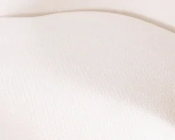 Petite chauffeuse tournante 360° en tissu chenillé blanc